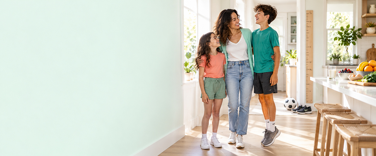 Happy family sharing a healthy breakfast in a bright kitchen, supporting kids' natural height growth